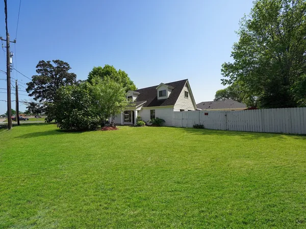 a backyard of a house with lots of green space