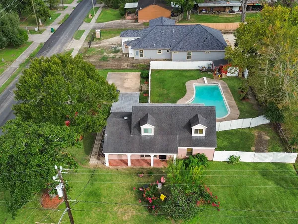 an aerial view of a house with a garden
