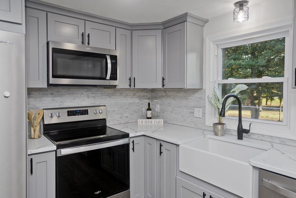 151 Fox Hill Road Springfield, MA 01118 - Photo 12 of 40 a kitchen with a sink stove and microwave