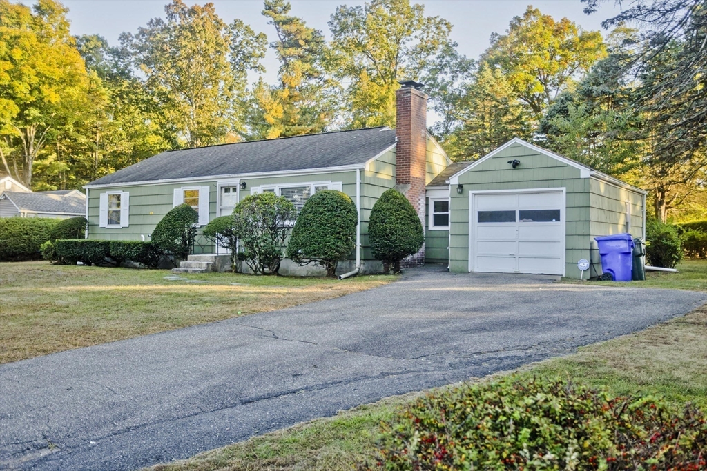 151 Fox Hill Road Springfield, MA 01118 - Photo 3 of 40 a front view of a house with a yard and garage