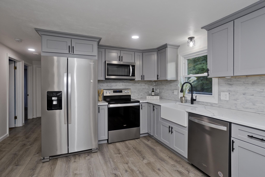 151 Fox Hill Road Springfield, MA 01118 - Photo 8 of 40 a kitchen with stainless steel appliances a refrigerator sink and microwave