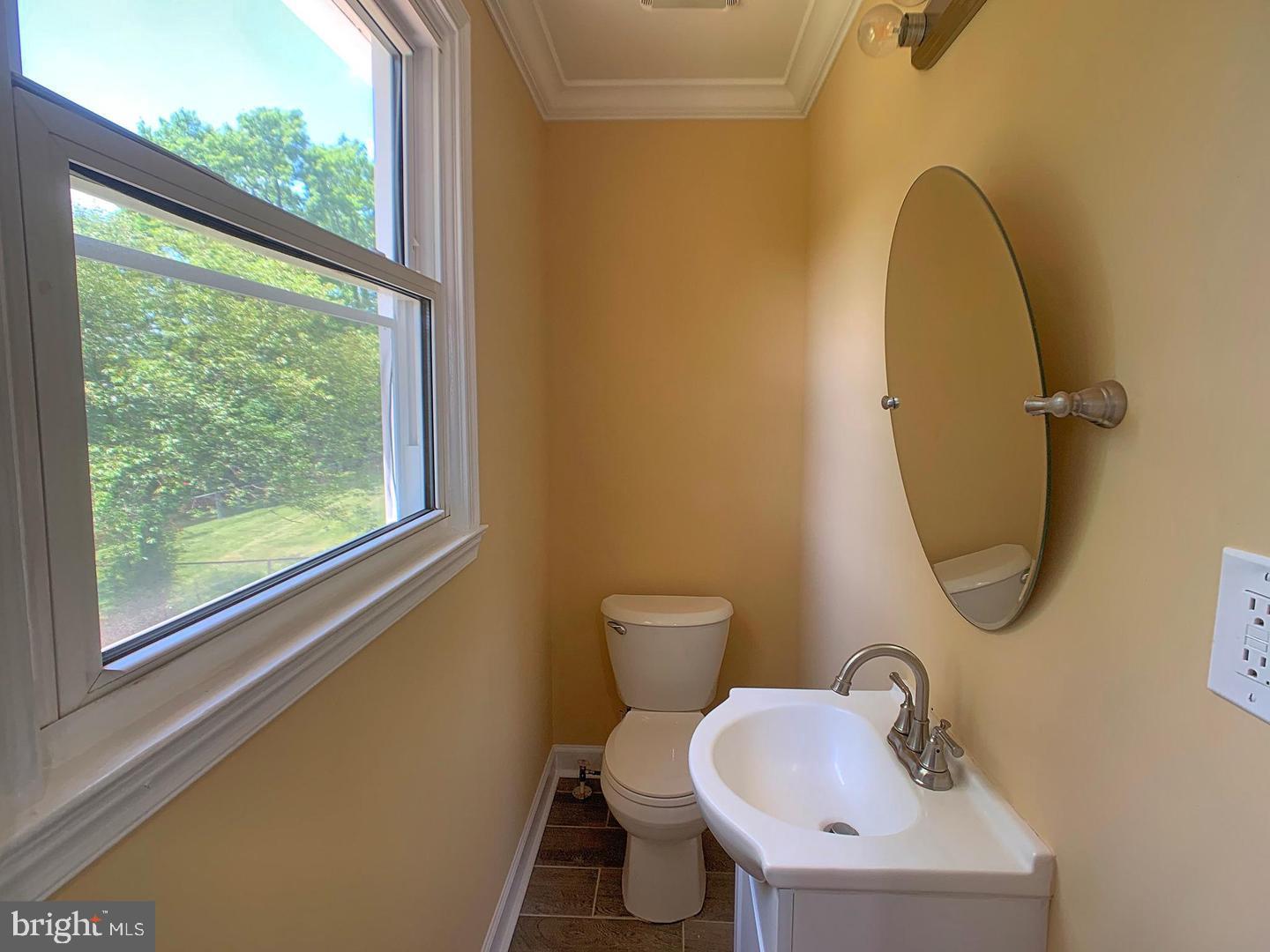 7907 Subet Road Windsor Mill, MD 21244 - Photo 16 of 31 a bathroom with a sink toilet and a mirror