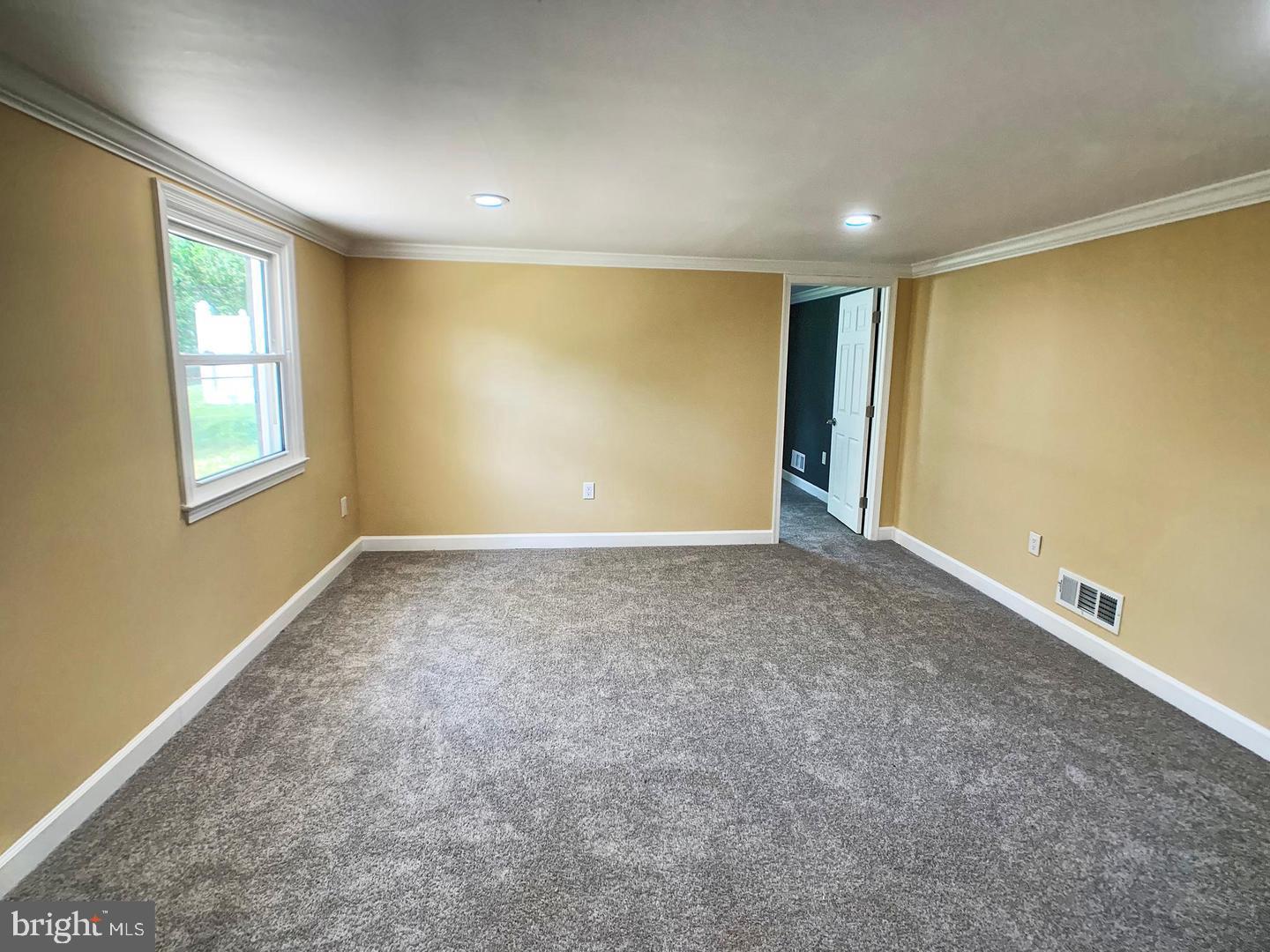 7907 Subet Road Windsor Mill, MD 21244 - Photo 23 of 31 a view of an empty room with a window