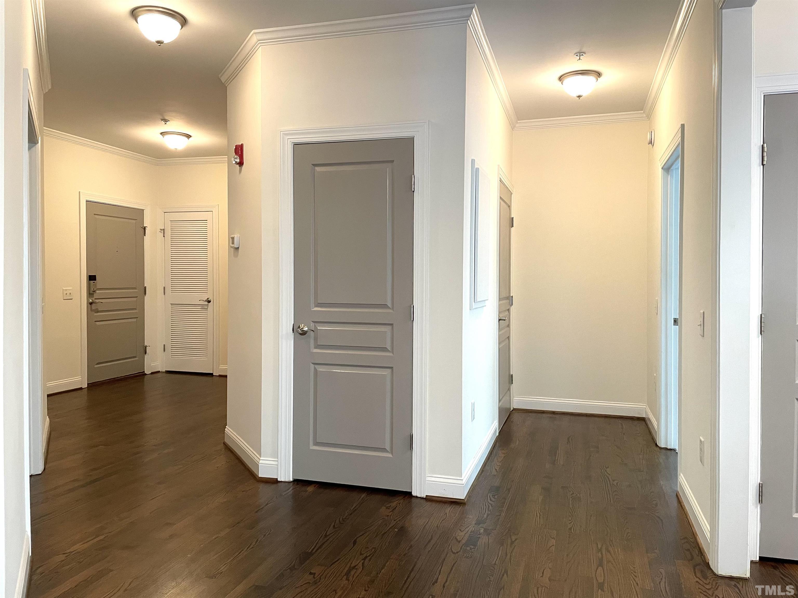 7510 Lead Mine Road, Unit 102 Raleigh, NC 27615 - Photo 11 of 25 a view of a hallway with wooden floor