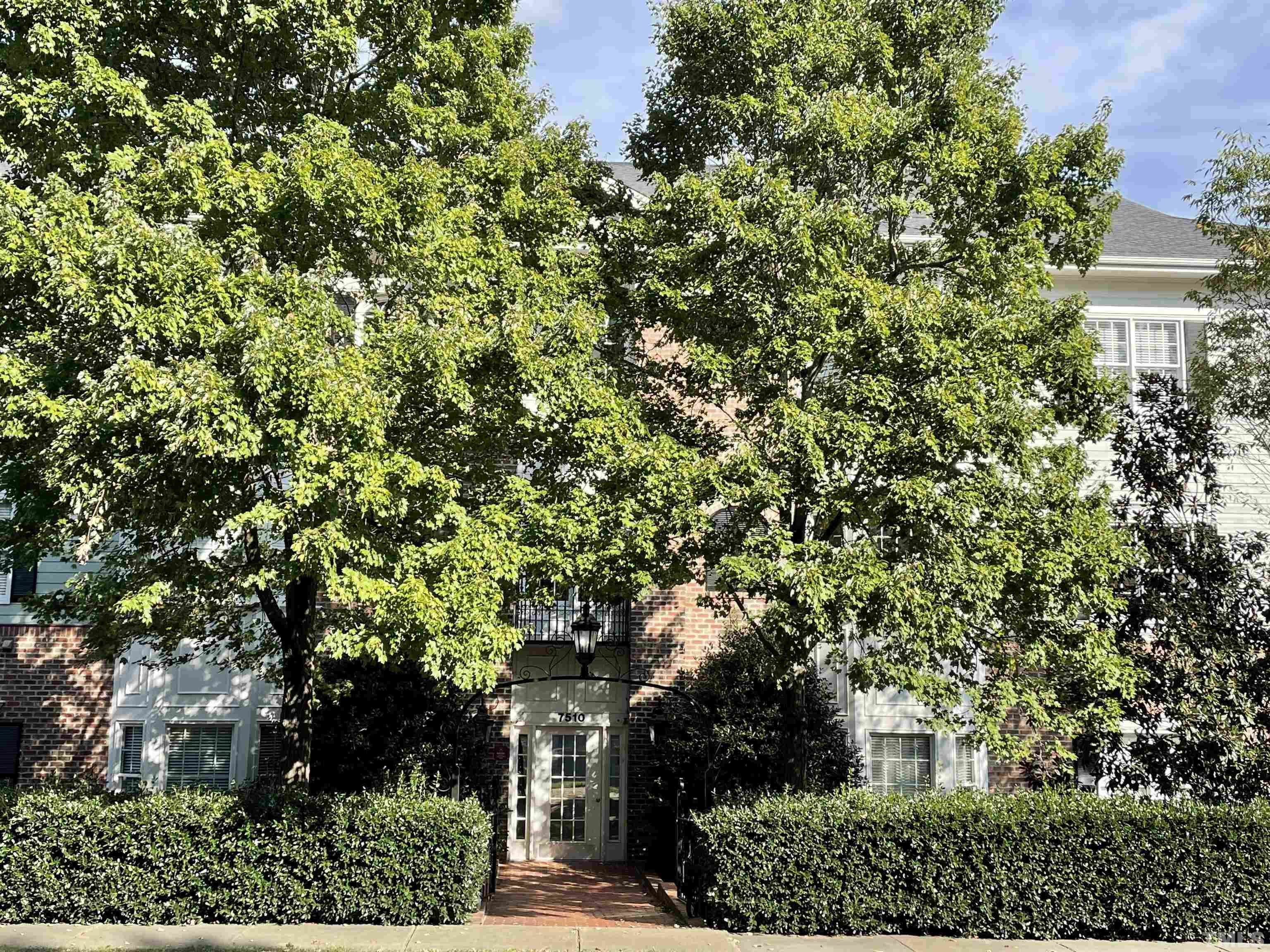 7510 Lead Mine Road, Unit 102 Raleigh, NC 27615 - Photo 23 of 25 an outdoor space with lots of trees