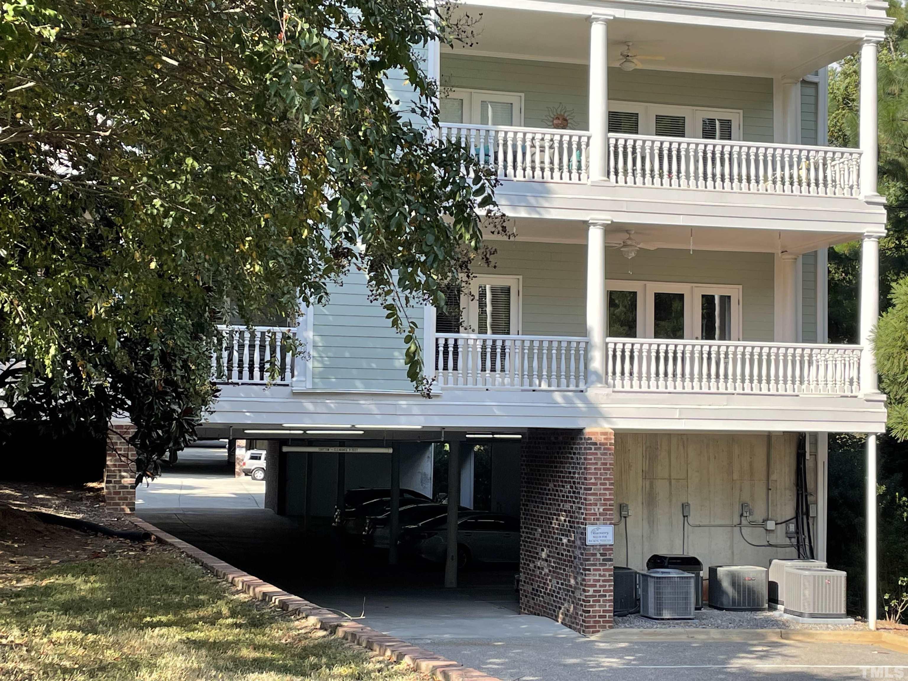 7510 Lead Mine Road, Unit 102 Raleigh, NC 27615 - Photo 24 of 25 a front view of a house with a wooden deck