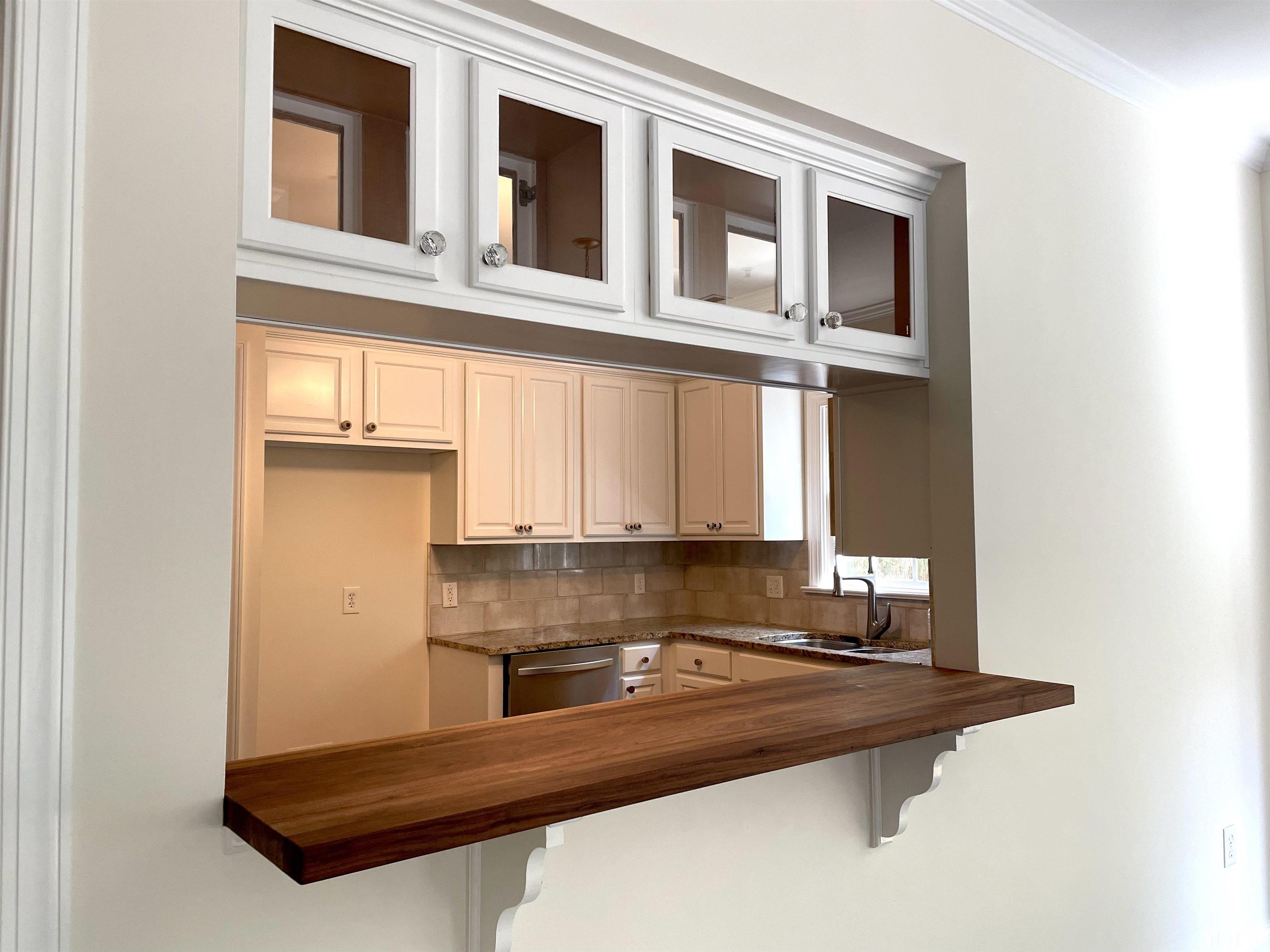 7510 Lead Mine Road, Unit 102 Raleigh, NC 27615 - Photo 4 of 25 a view of kitchen with wooden floor