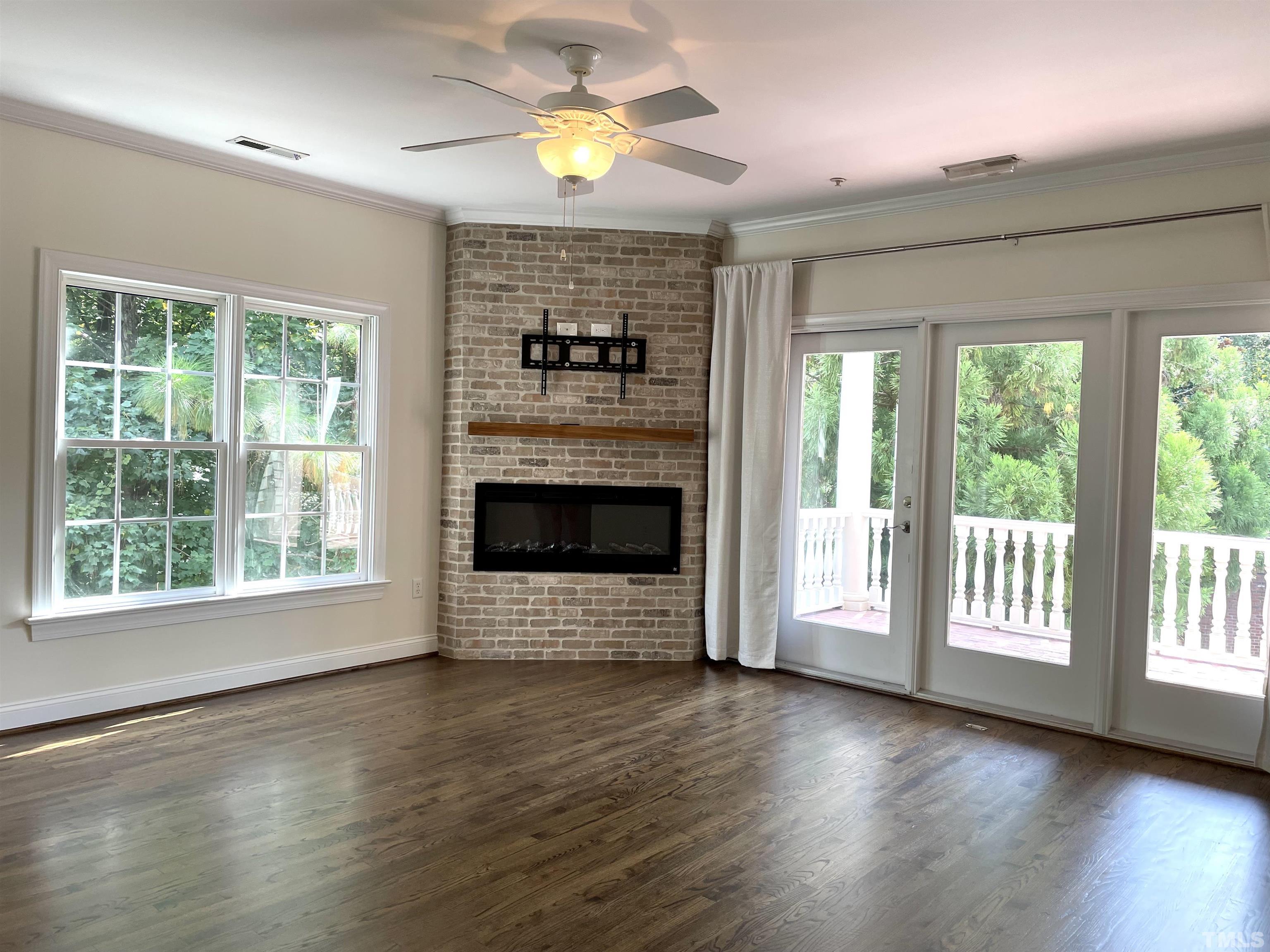 7510 Lead Mine Road, Unit 102 Raleigh, NC 27615 - Photo 7 of 25 a view of a livingroom with a fireplace and window