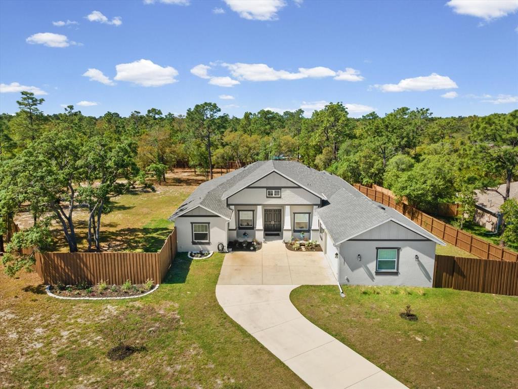 11981 Robina Road Weeki Wachee, FL 34614 - Photo 66 of 93 a view of a house with a yard