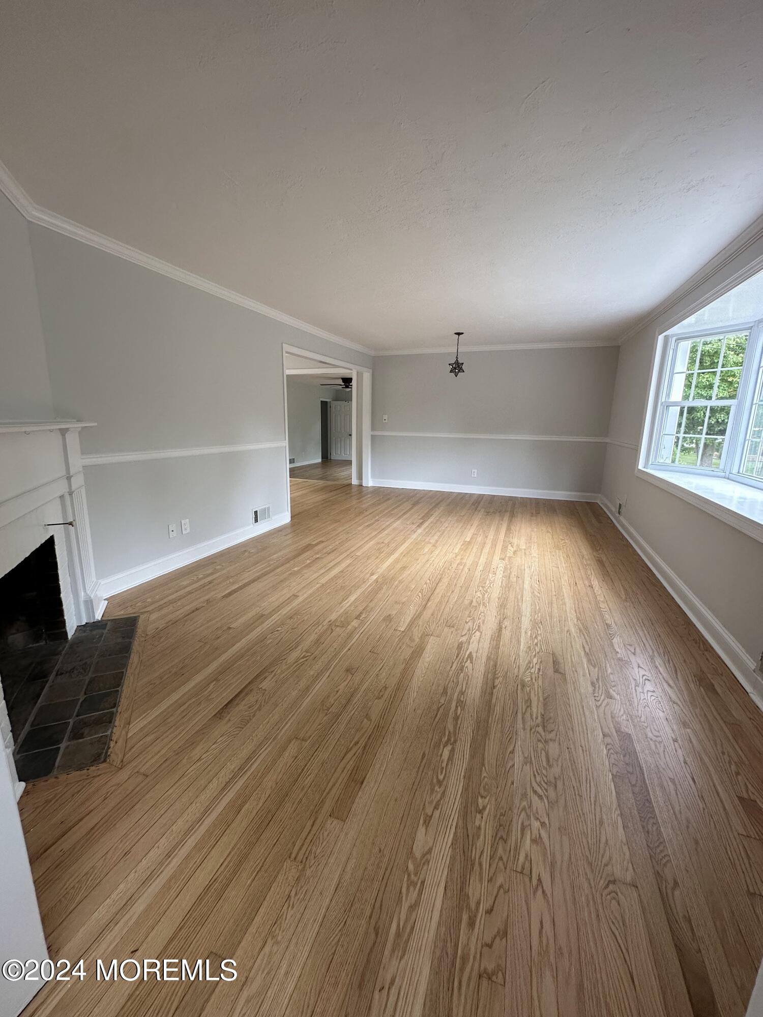 57 Kings Road Little Silver, NJ 07739 - Photo 4 of 22 wooden floor in an empty room with a window