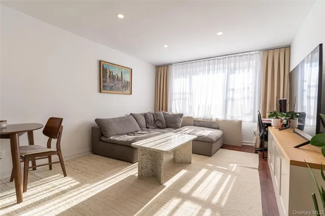 a living room with furniture and a window