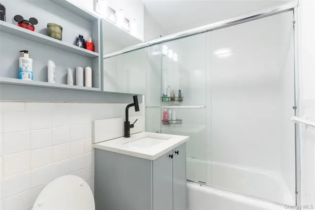 a bathroom with a sink a toilet and a bathtub