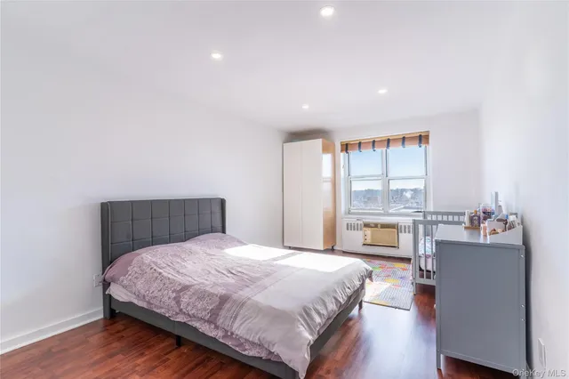 a bedroom with a large bed and a table