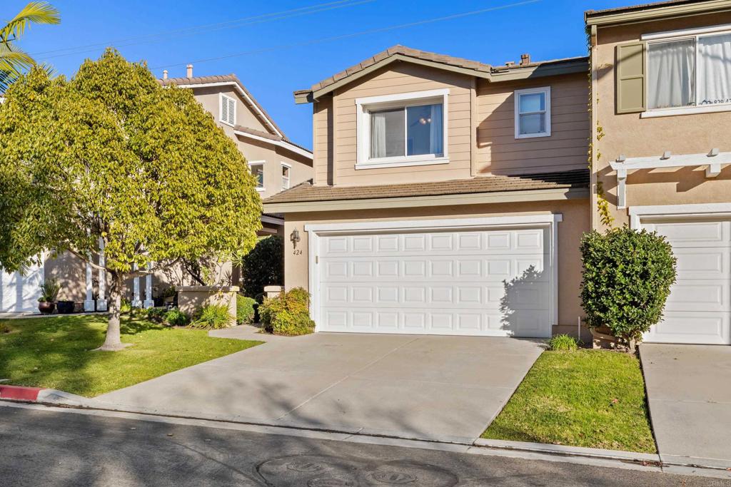 424 Dakota Way Oceanside, CA 92056 - Photo 2 of 31 a front view of a house with a yard