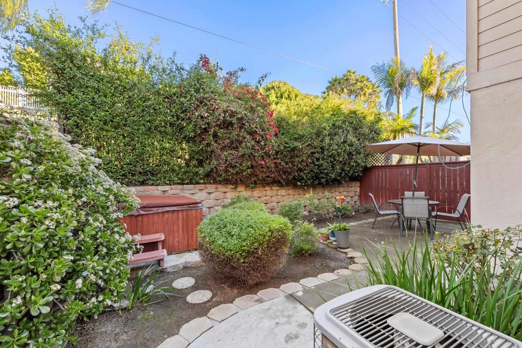 424 Dakota Way Oceanside, CA 92056 - Photo 24 of 31 a view of a garden with plants and a bench