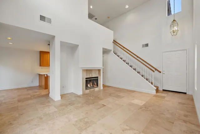 a view of a livingroom with an empty space and a fireplace