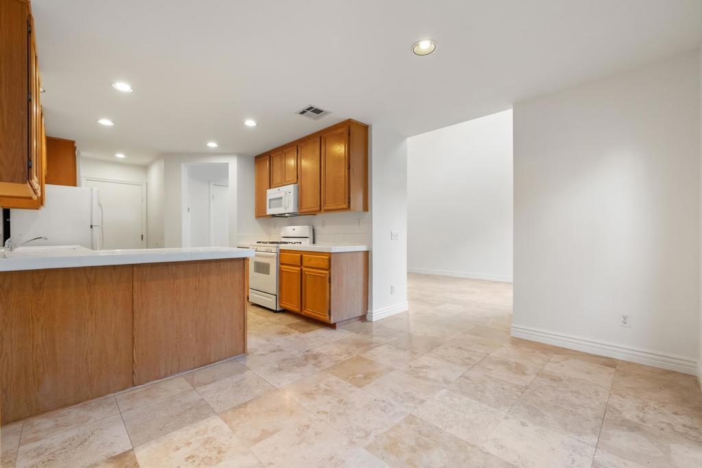 424 Dakota Way Oceanside, CA 92056 - Photo 6 of 31 a view of kitchen with stainless steel appliances granite countertop a stove a sink and a refrigerator