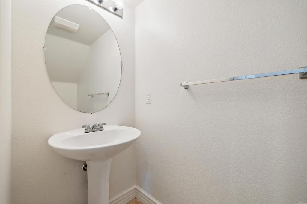 424 Dakota Way Oceanside, CA 92056 - Photo 9 of 31 a bathroom with a sink and a mirror