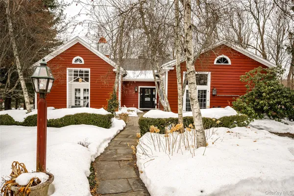 a view of house with yard