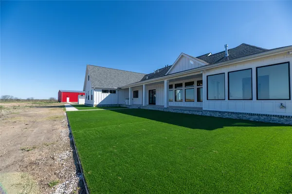 a view of a lake with a big yard