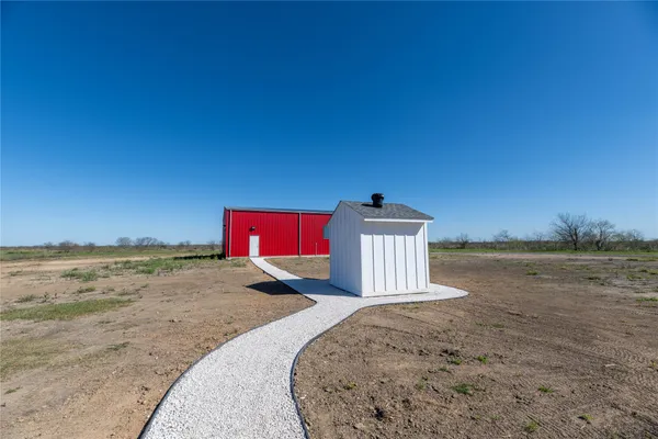 a view of a red wall with an umbrella