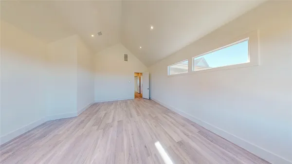 a view of empty room with stairs