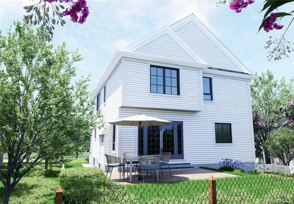 a view of house with a yard and potted plants