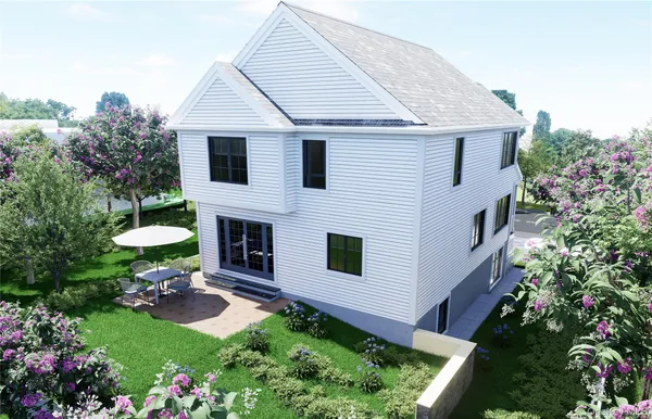 a front view of a house with a garden and a garden