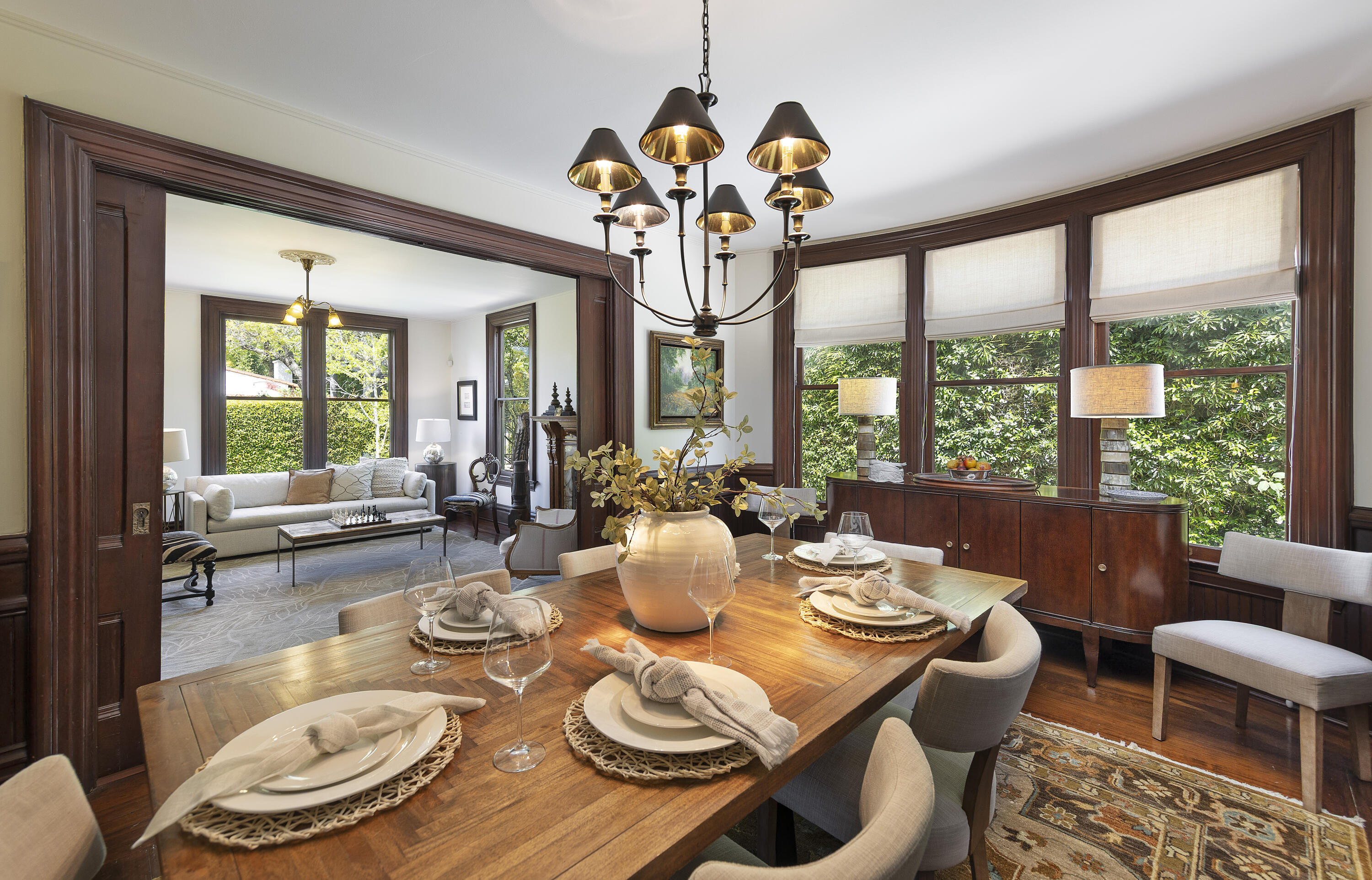 118 East Islay Street Santa Barbara, CA 93101 - Photo 12 of 44 a dining room with furniture a large window and a chandelier