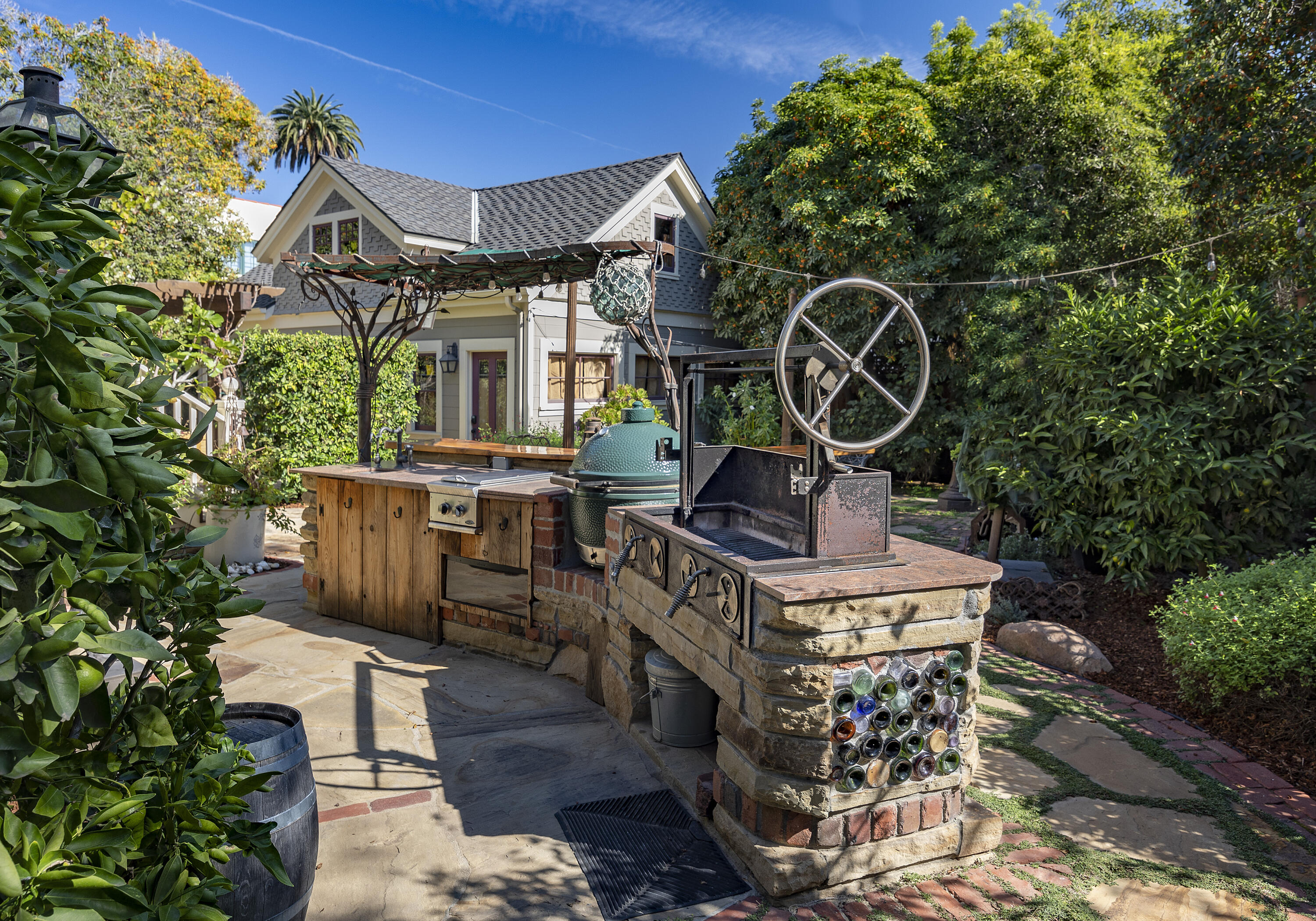 118 East Islay Street Santa Barbara, CA 93101 - Photo 39 of 44 a view of a chairs and table in backyard