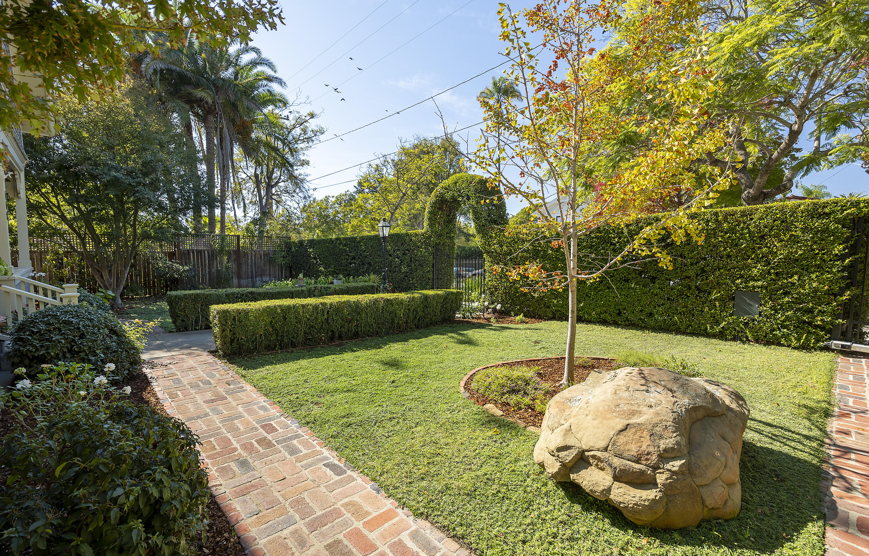 118 East Islay Street Santa Barbara, CA 93101 - Photo 4 of 44 a swimming pool with lots of tress in the background