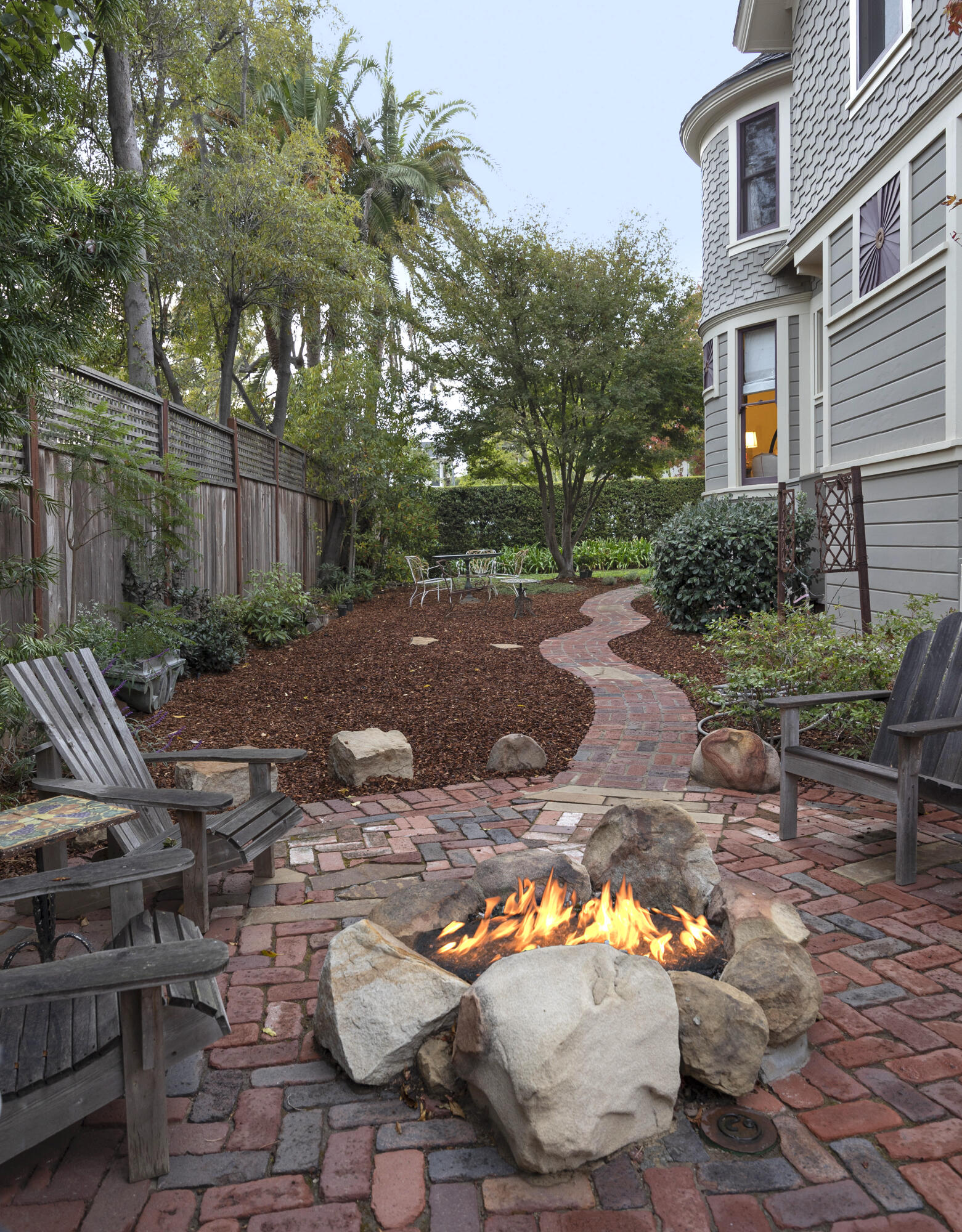 118 East Islay Street Santa Barbara, CA 93101 - Photo 42 of 44 a backyard of a house with yard fire pit and outdoor seating