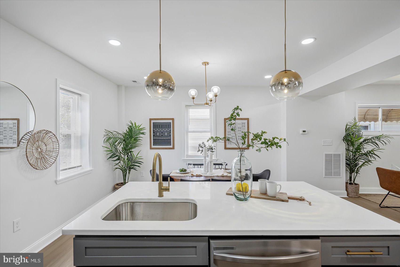 5412 Clover Road Baltimore, MD 21215 - Photo 15 of 42 a kitchen with a sink and a mirror