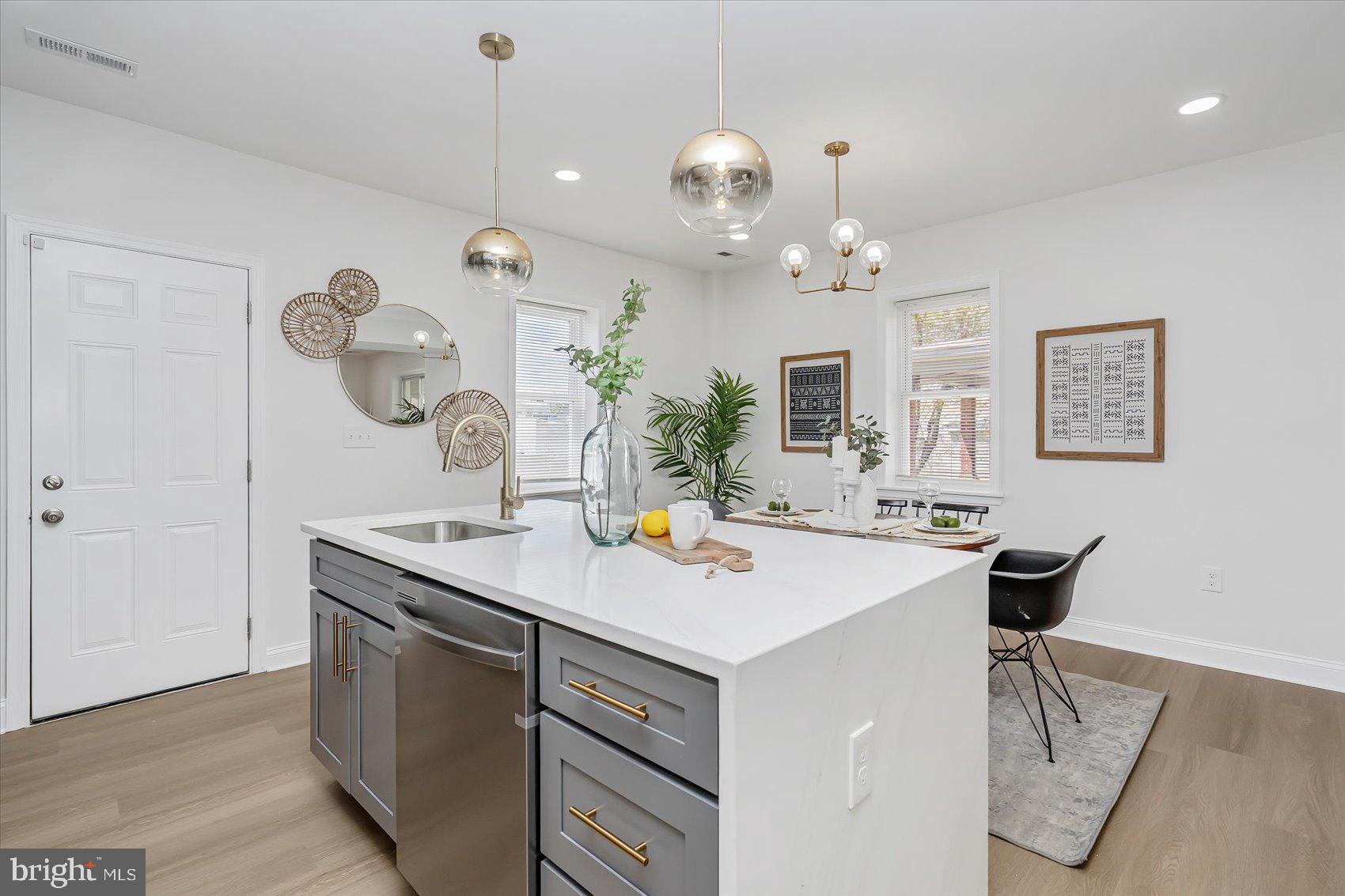5412 Clover Road Baltimore, MD 21215 - Photo 16 of 42 a view of a dining room with a table and chairs
