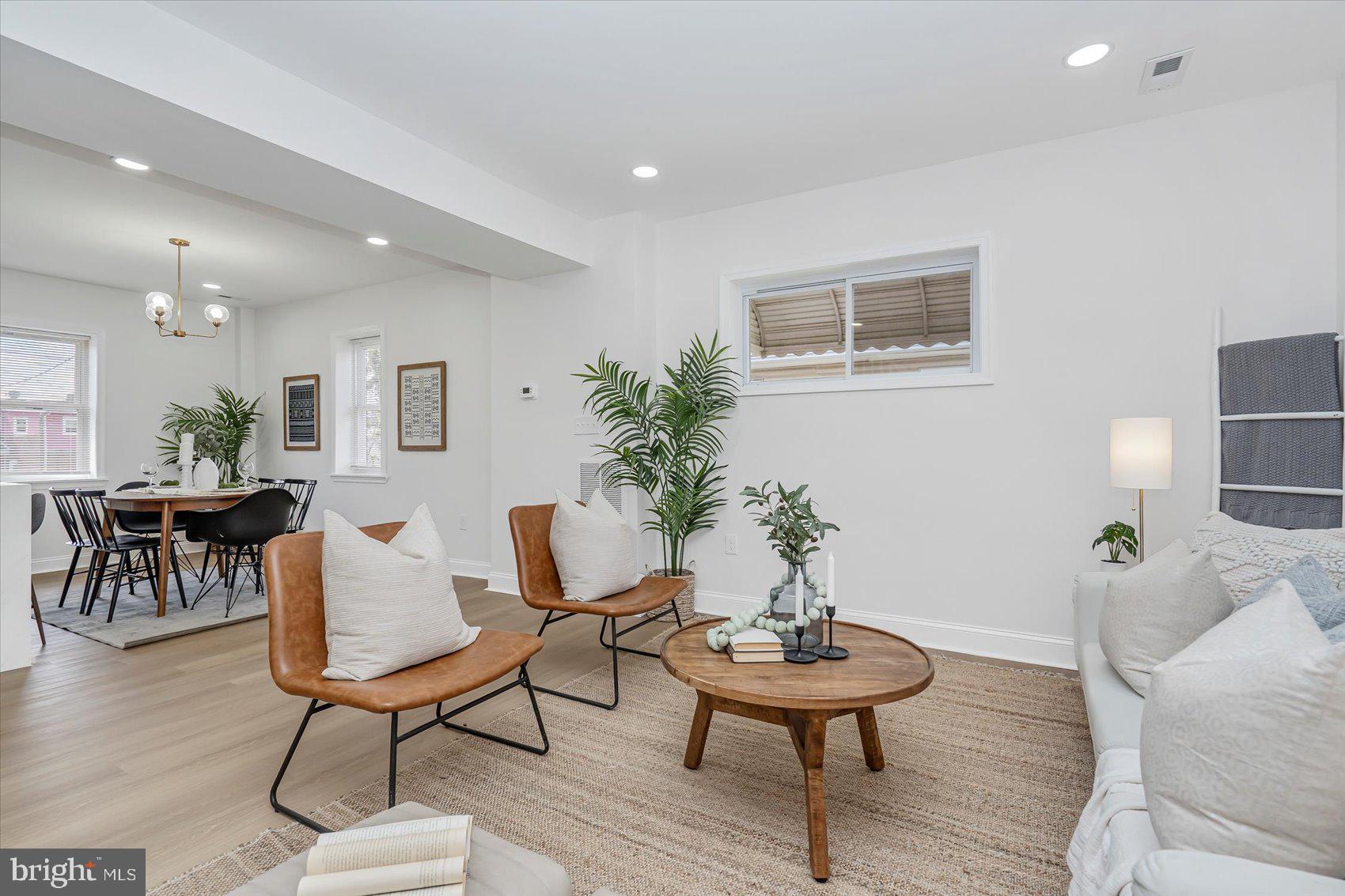 5412 Clover Road Baltimore, MD 21215 - Photo 2 of 42 a living room with furniture and a potted plant