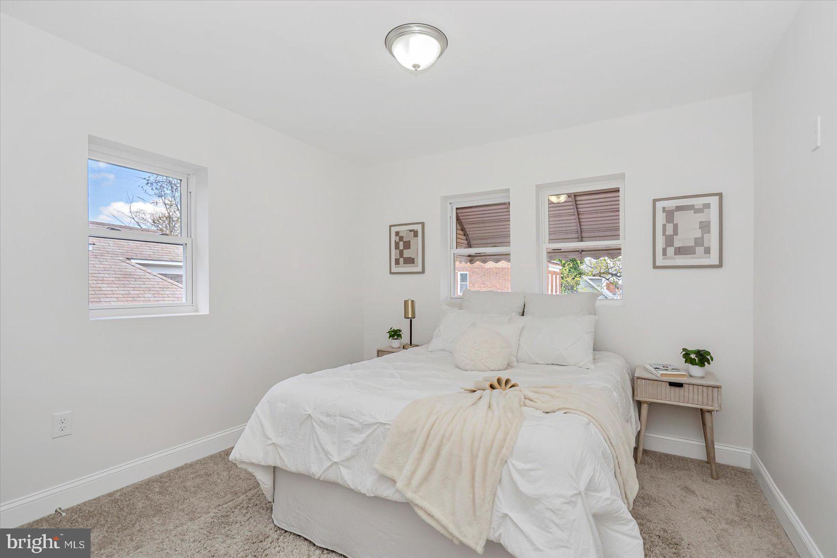 5412 Clover Road Baltimore, MD 21215 - Photo 23 of 42 a bedroom with a bed and painting on the wall
