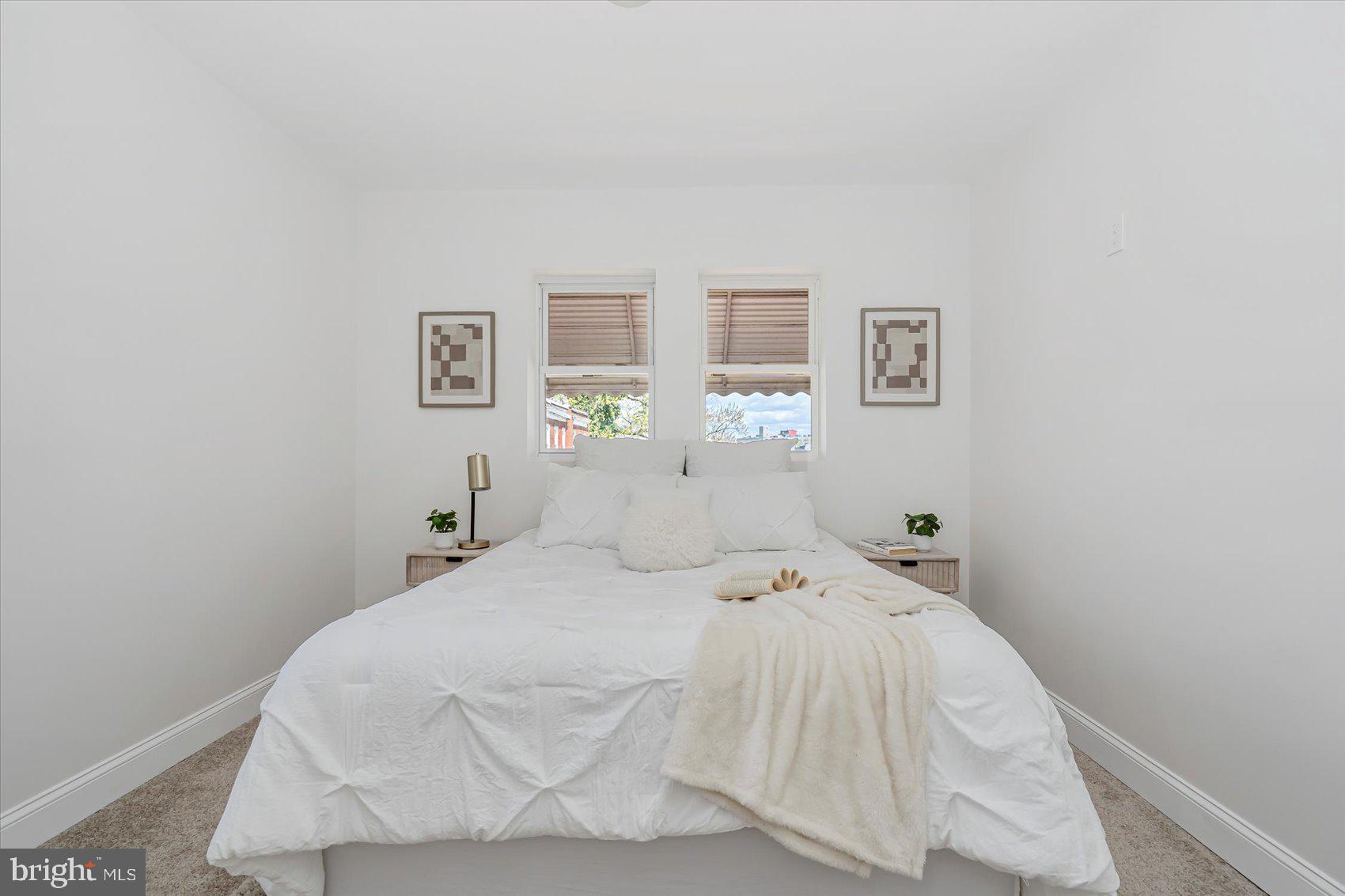 5412 Clover Road Baltimore, MD 21215 - Photo 24 of 42 a bedroom with a bed and window