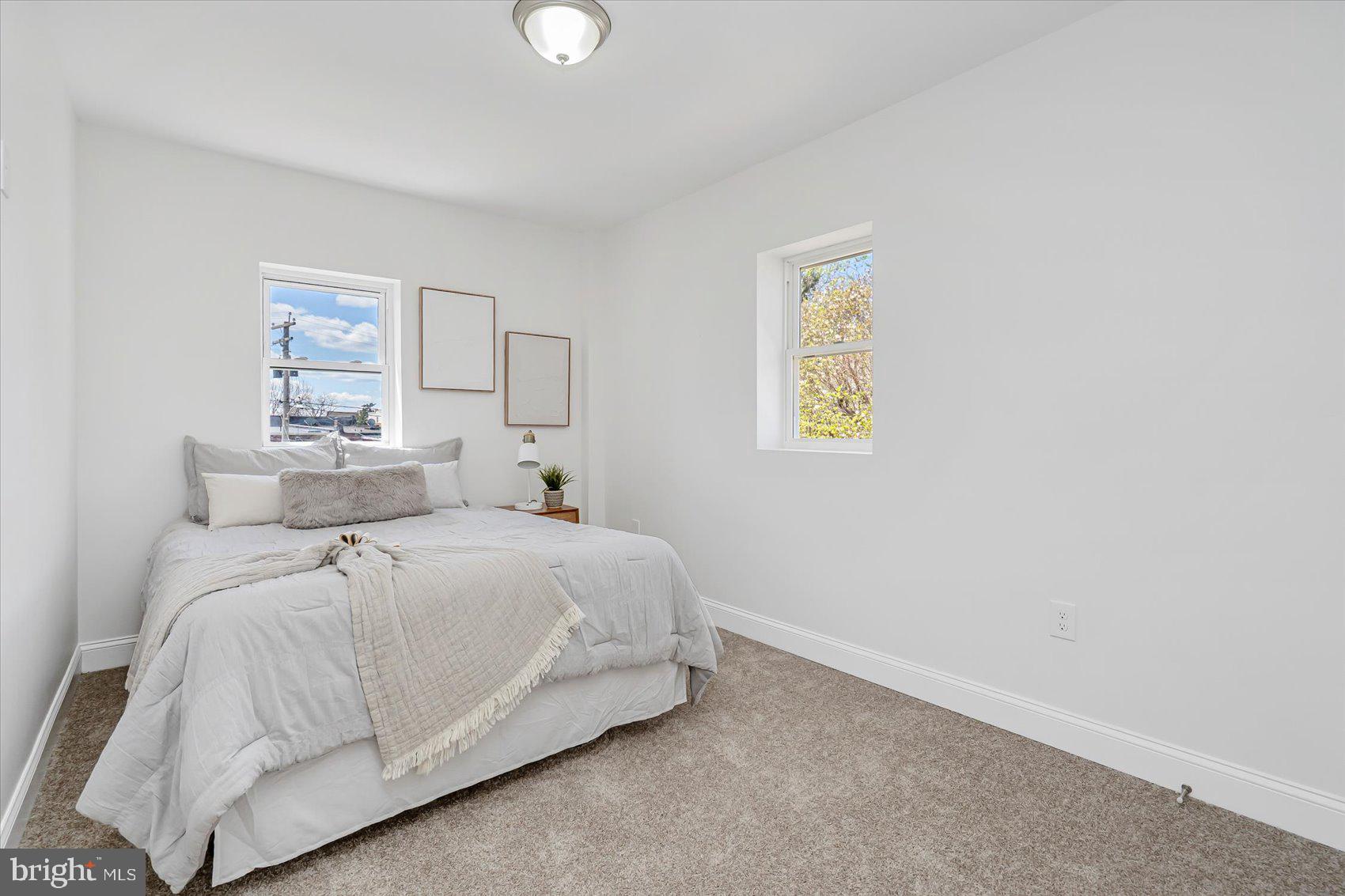 5412 Clover Road Baltimore, MD 21215 - Photo 28 of 42 a bedroom with a bed and painting on the wall