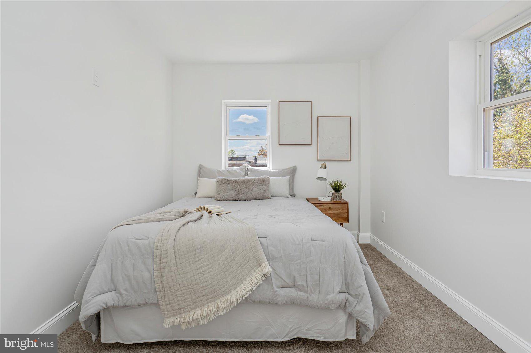 5412 Clover Road Baltimore, MD 21215 - Photo 29 of 42 a bedroom with a bed and window