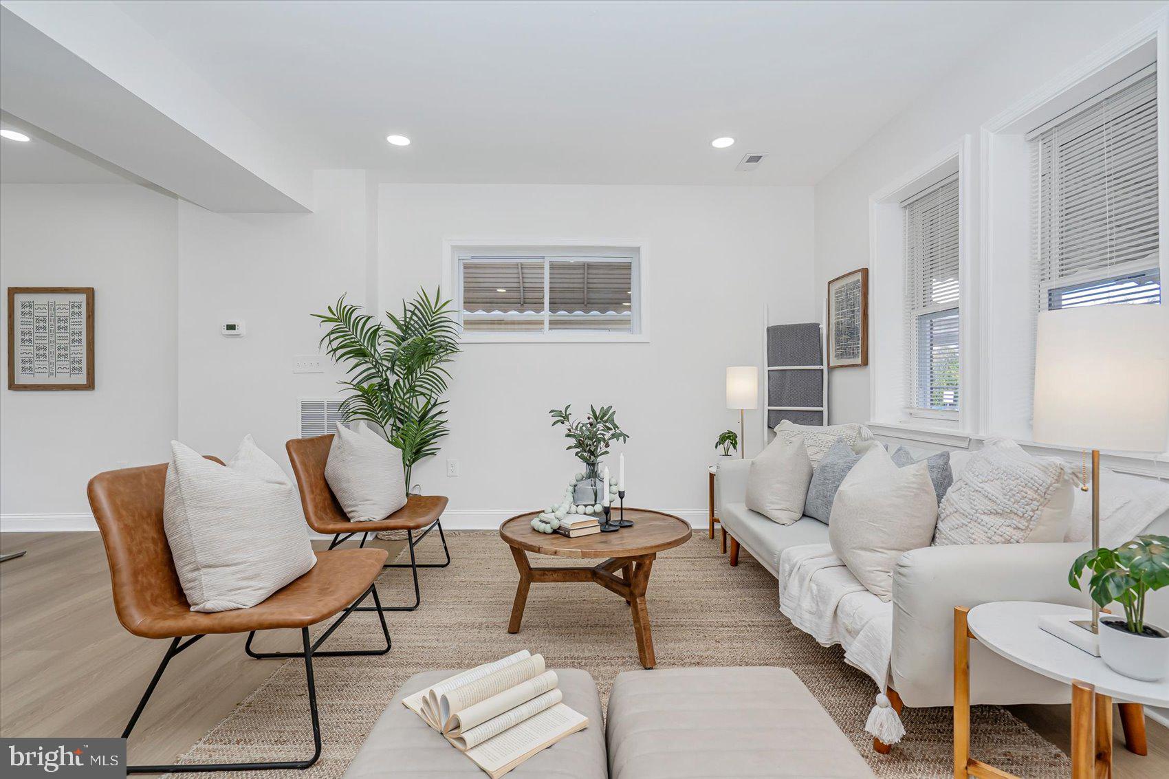 5412 Clover Road Baltimore, MD 21215 - Photo 3 of 42 a living room with furniture and a potted plant