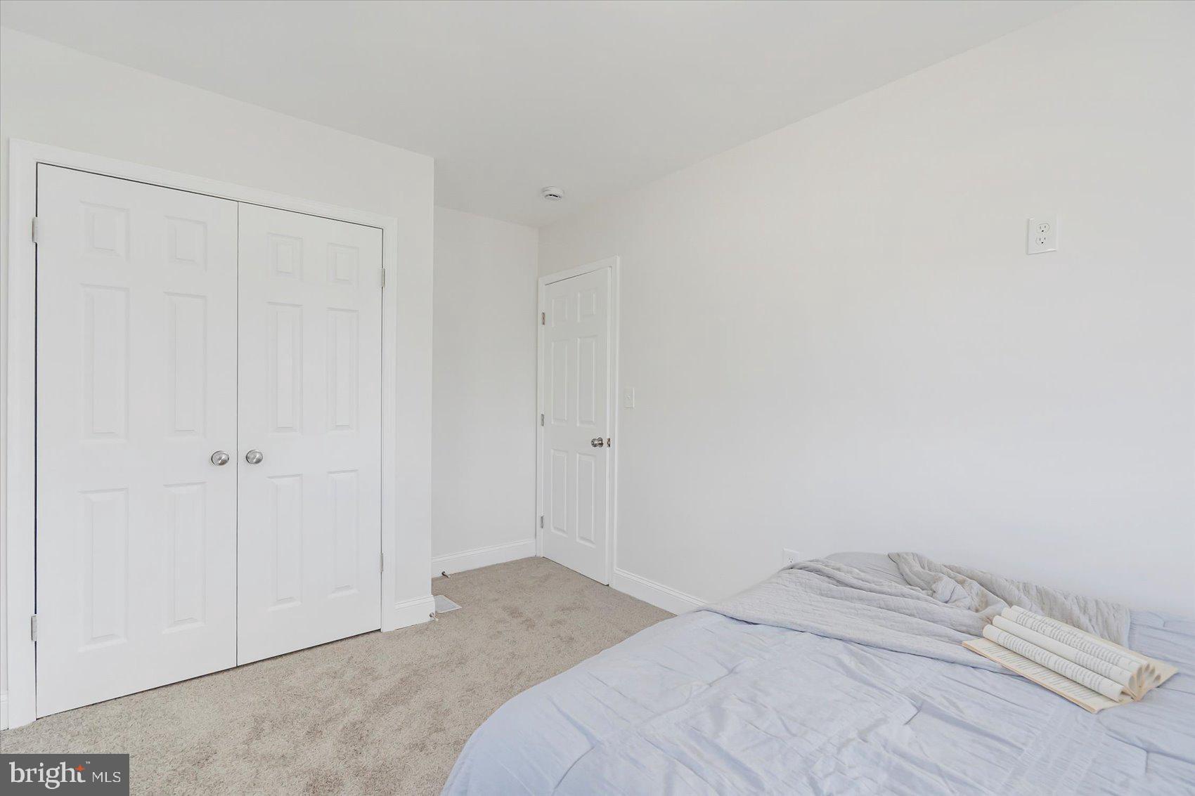 5412 Clover Road Baltimore, MD 21215 - Photo 31 of 42 a bedroom with a bed and a shower