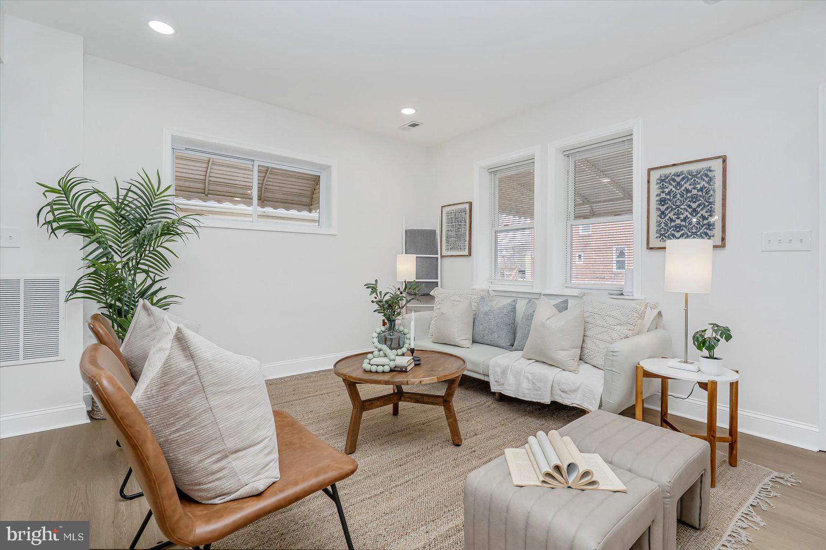 5412 Clover Road Baltimore, MD 21215 - Photo 4 of 42 a living room with furniture and a potted plant