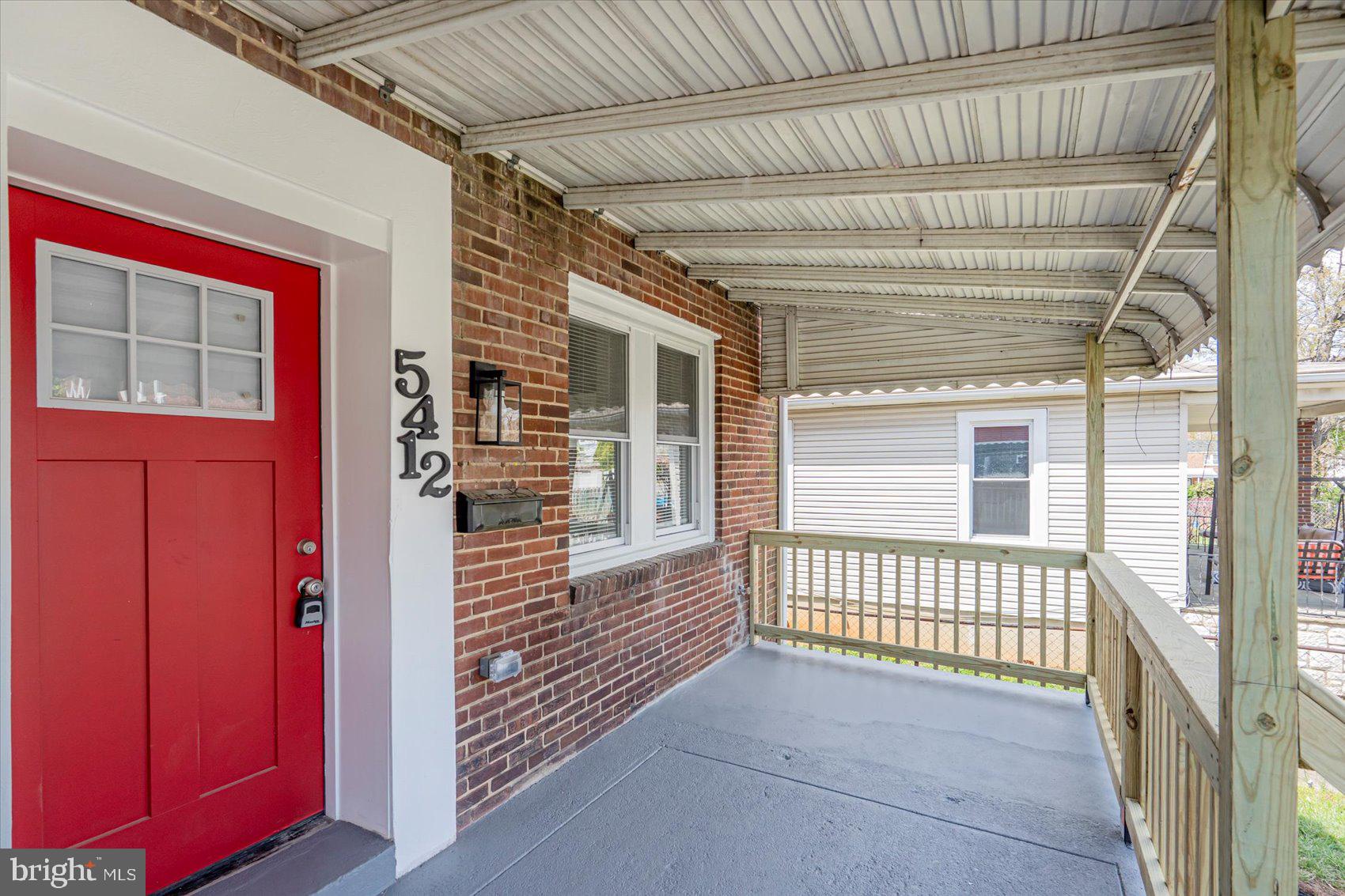 5412 Clover Road Baltimore, MD 21215 - Photo 42 of 42 a view of porch with a door and wooden floor