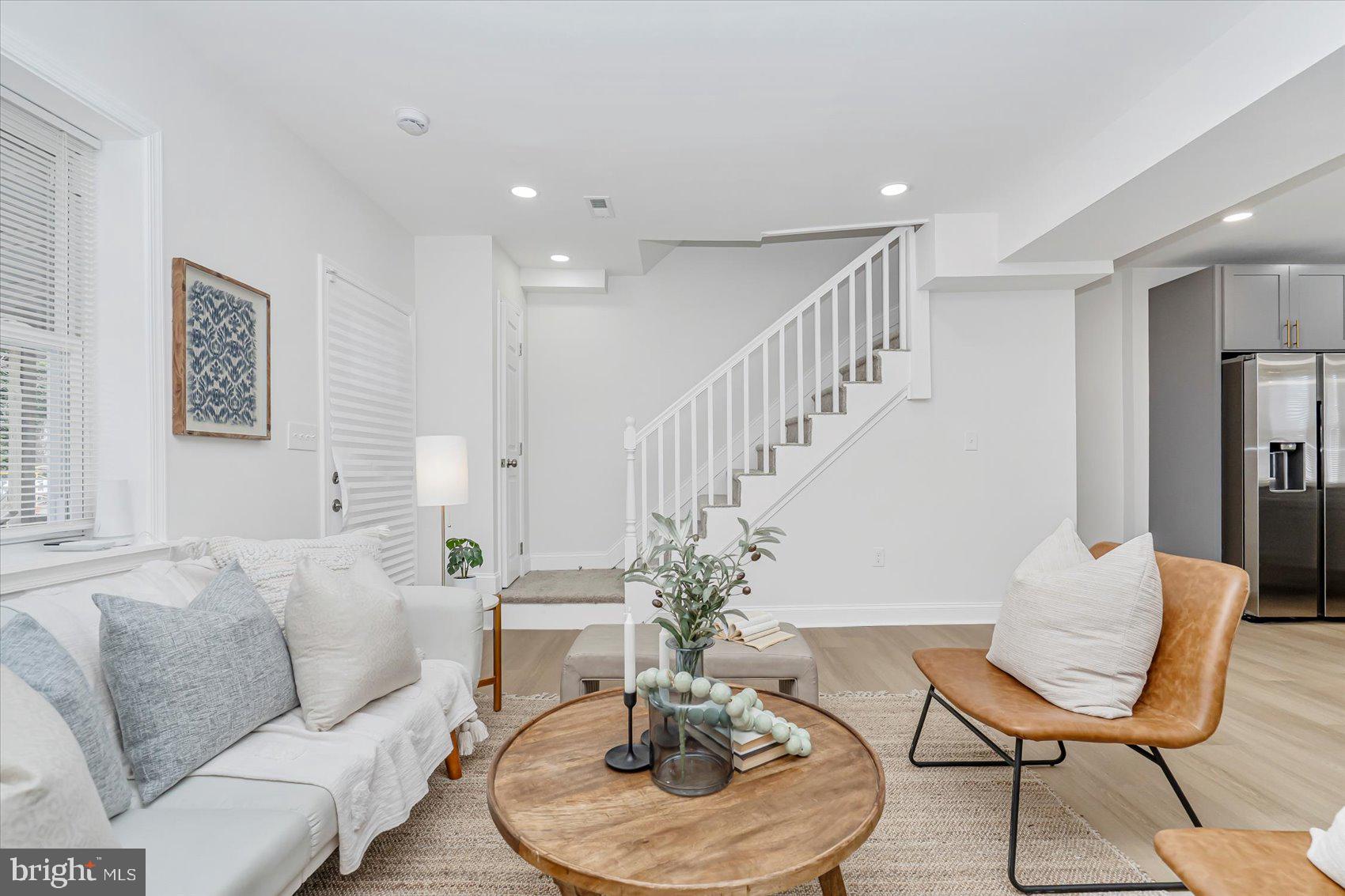 5412 Clover Road Baltimore, MD 21215 - Photo 7 of 42 a living room with furniture and a dining table