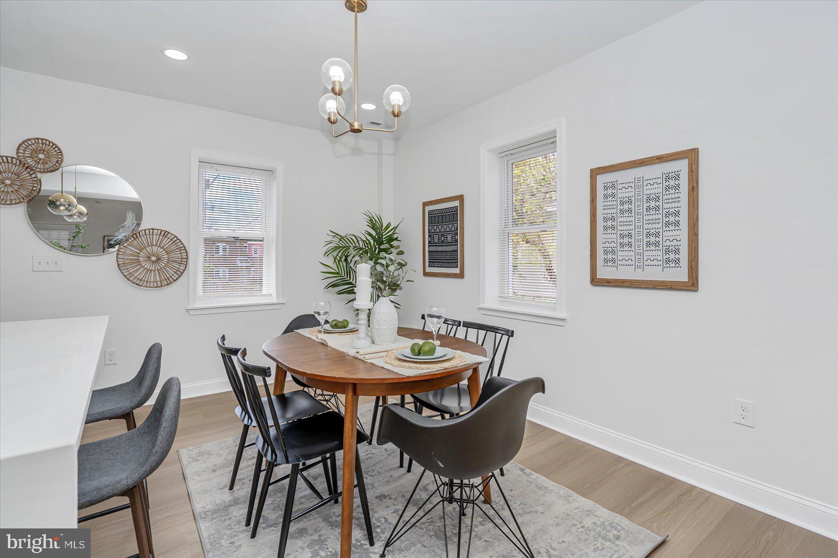 5412 Clover Road Baltimore, MD 21215 - Photo 9 of 42 a view of a dining room with furniture and chandelier