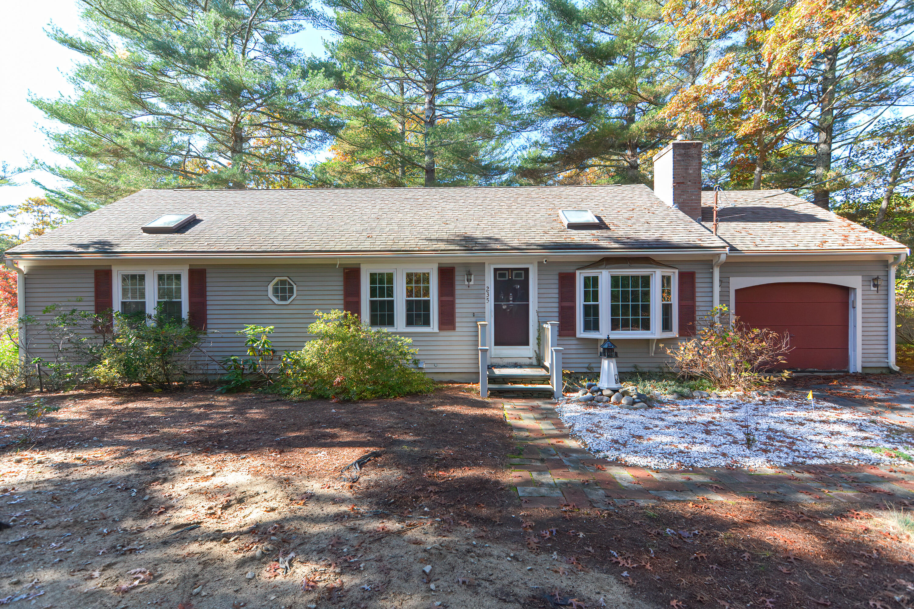 235 Simon Narrows Road Mashpee, MA 02649 - Photo 1 of 30 a front view of a house with yard tree and porch