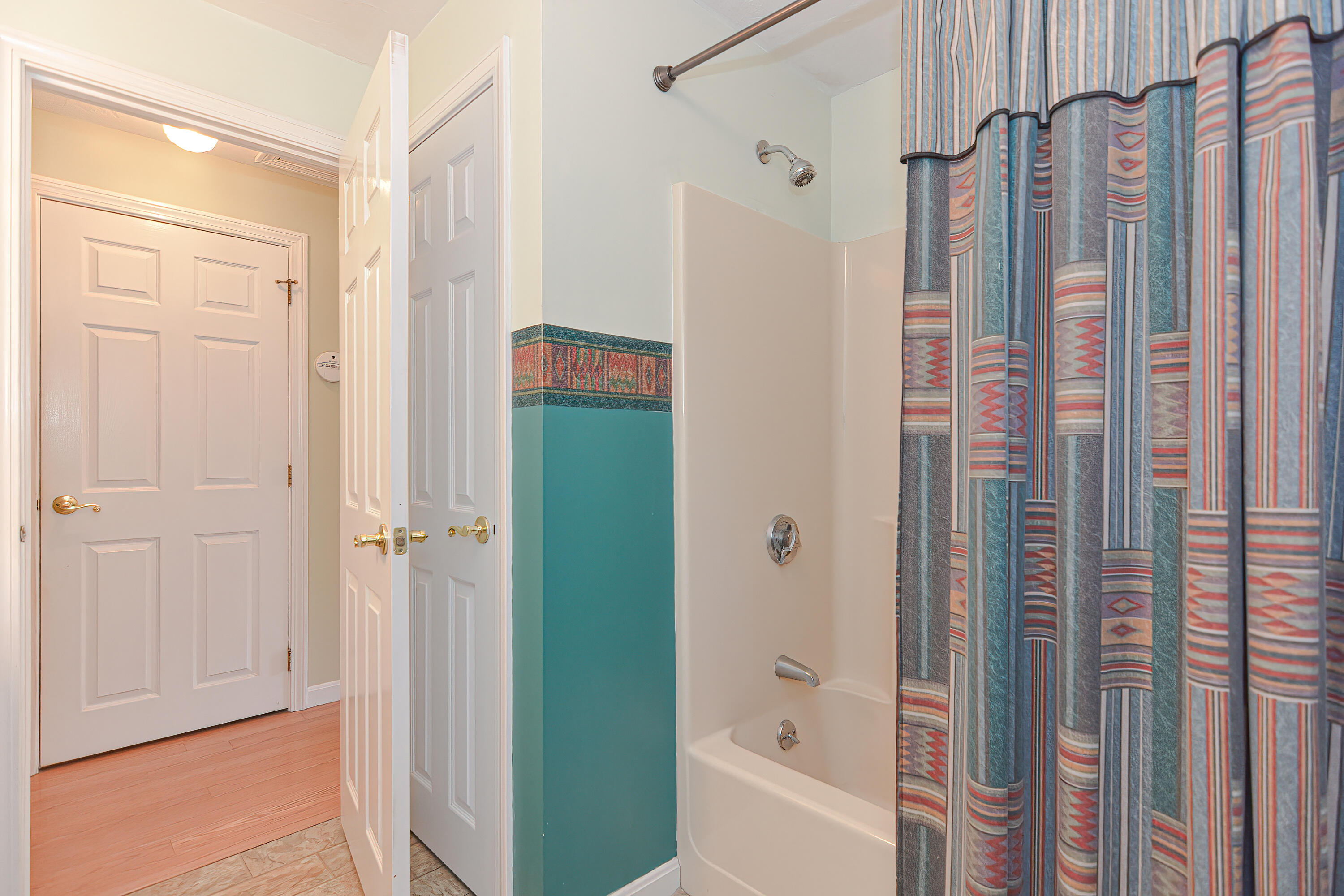 235 Simon Narrows Road Mashpee, MA 02649 - Photo 20 of 30 a bathroom with a shower and a tub