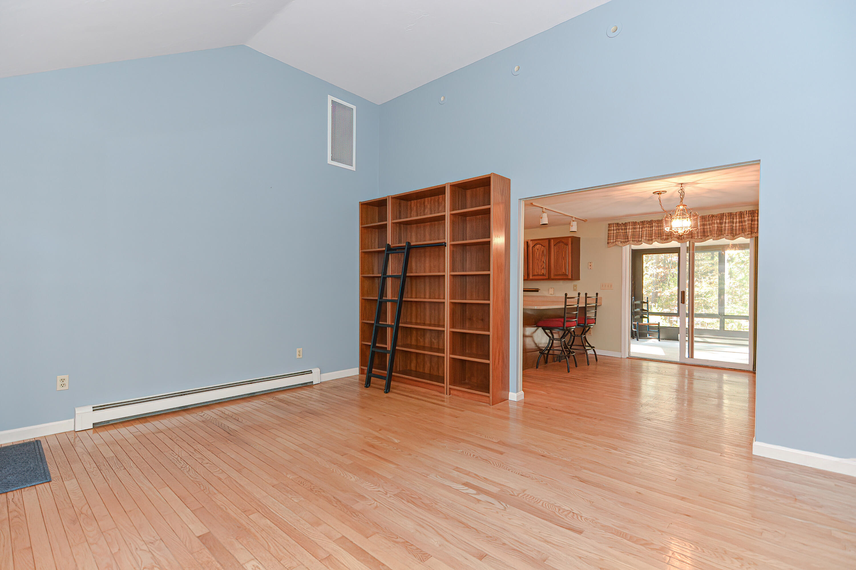235 Simon Narrows Road Mashpee, MA 02649 - Photo 9 of 30 an empty room with furniture and wooden floor