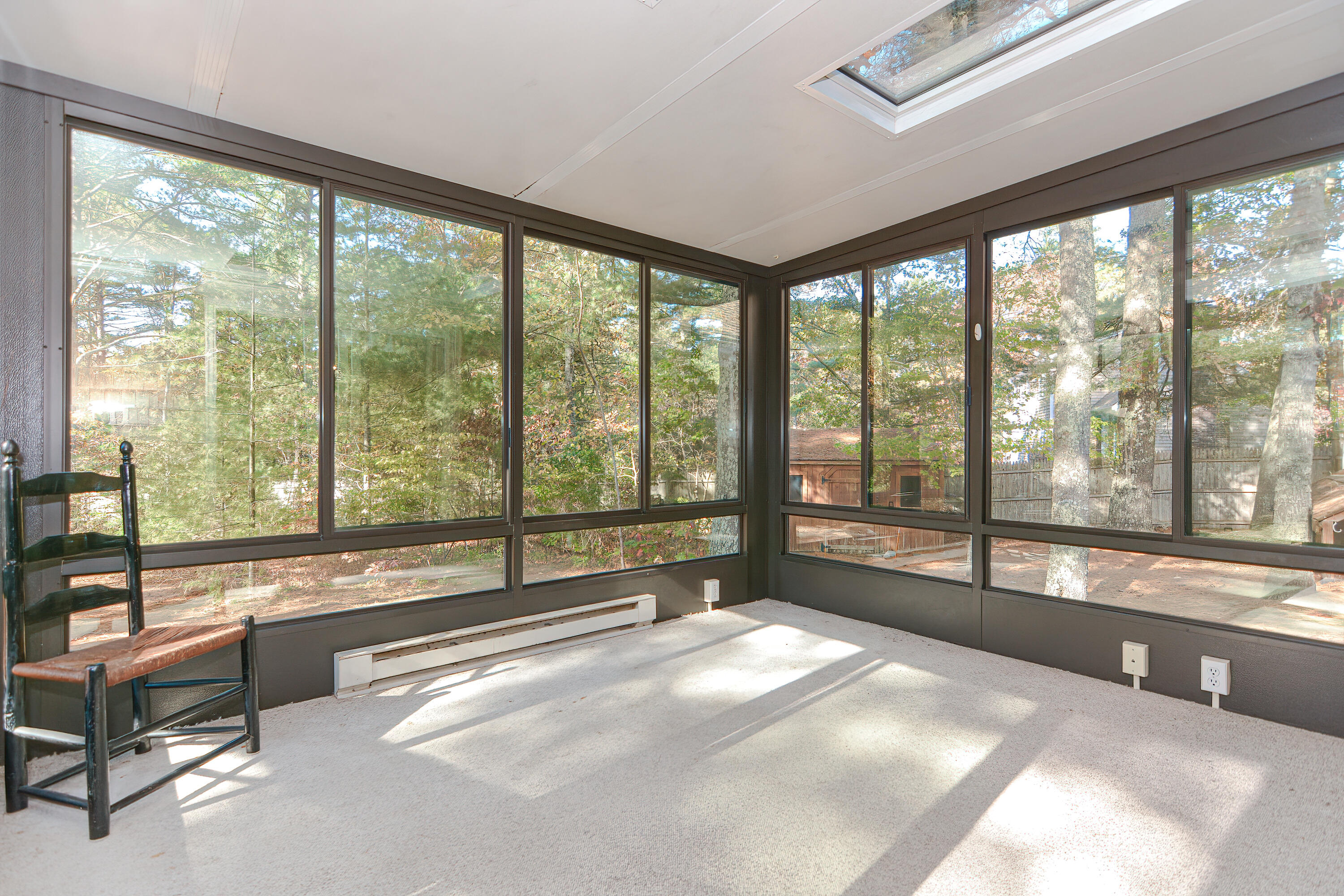 235 Simon Narrows Road Mashpee, MA 02649 - Photo 10 of 30 a view of an empty room and a large window