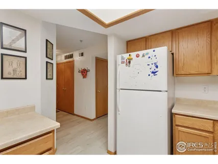 a white refrigerator freezer sitting inside of a kitchen